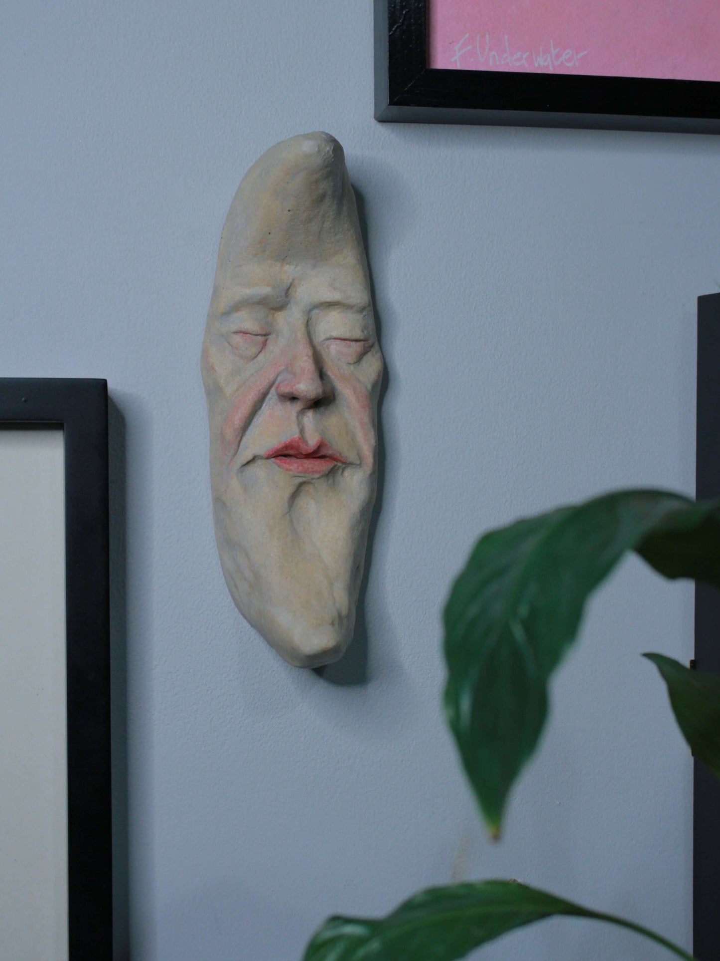 Pale Crescent Moon Ceramic Wall Ornament - Closed Eyes