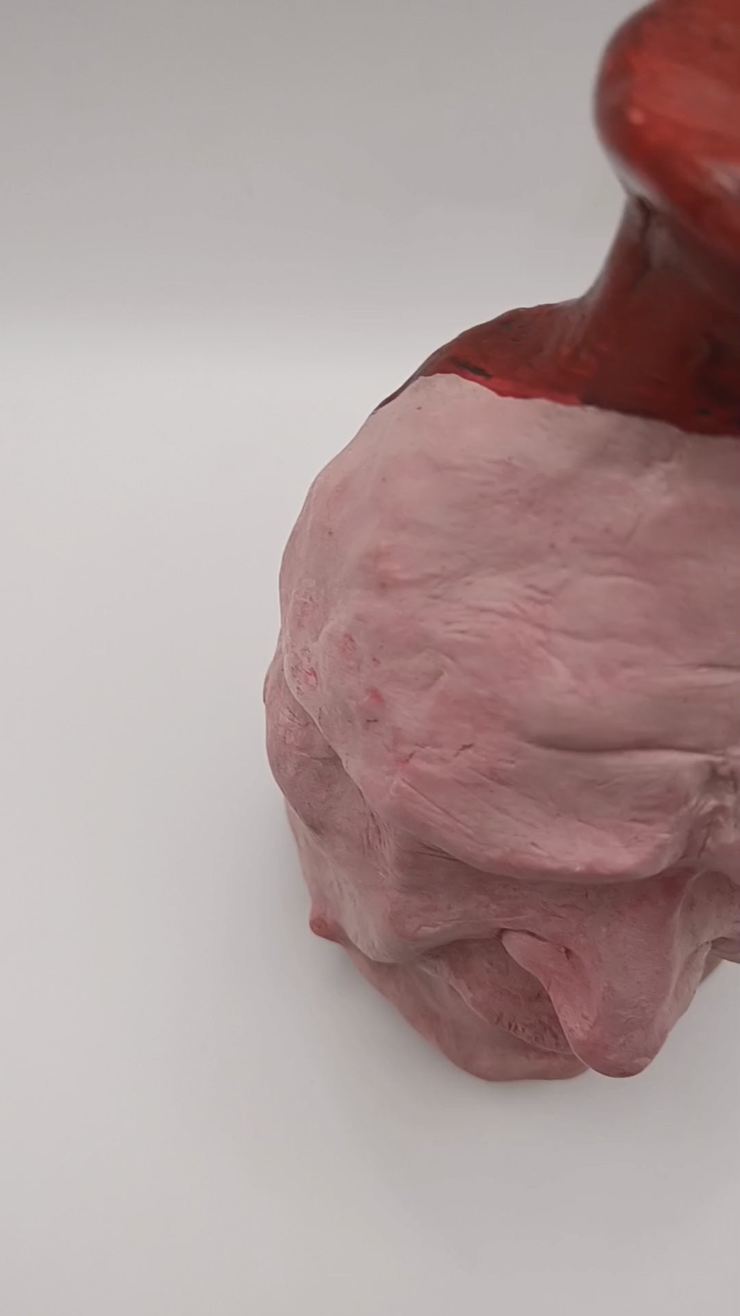 Handmade clay death mask vase, studio video