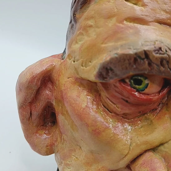 Hand sculpted clay yellow face mask sculpture lightbox video