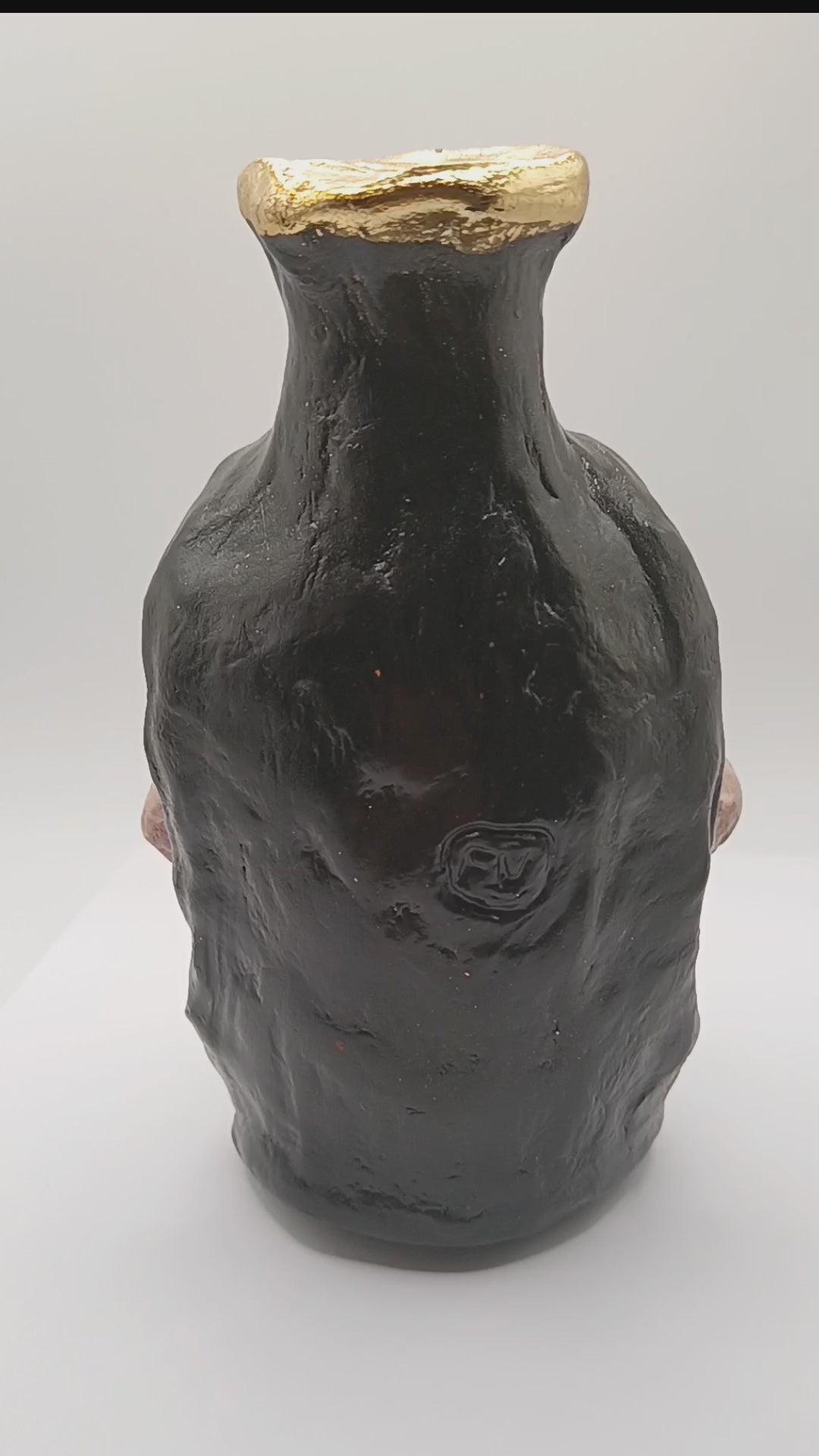 hand sculpted Skull vase180 degree view video
