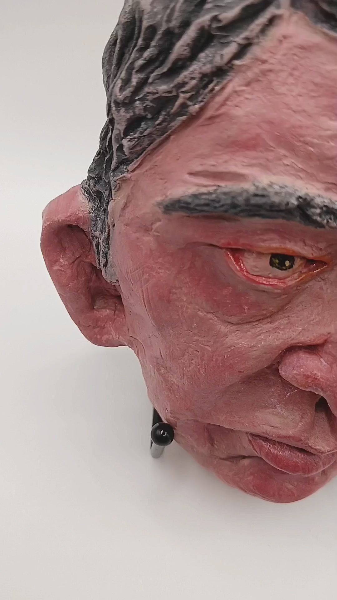 male clay sculpture lightbox video