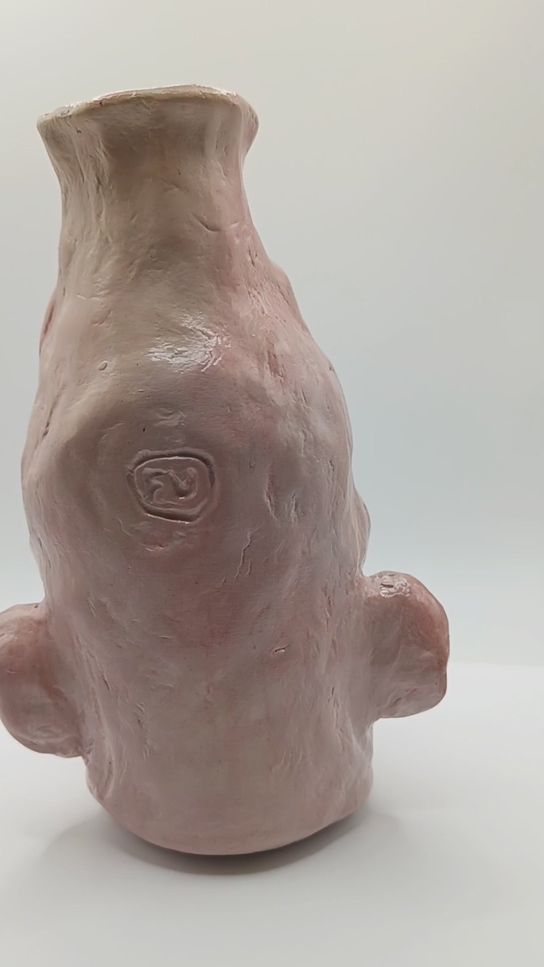 handmade realistic face vase, 180 degree view, video