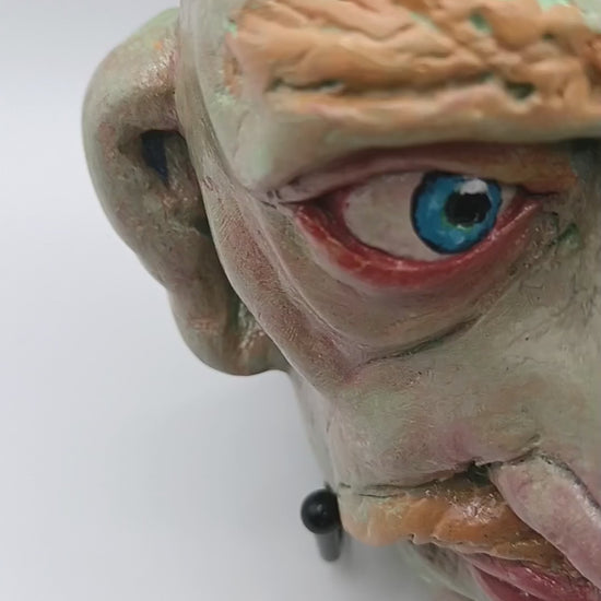 Hand sculpted green man sculpture lightbox video