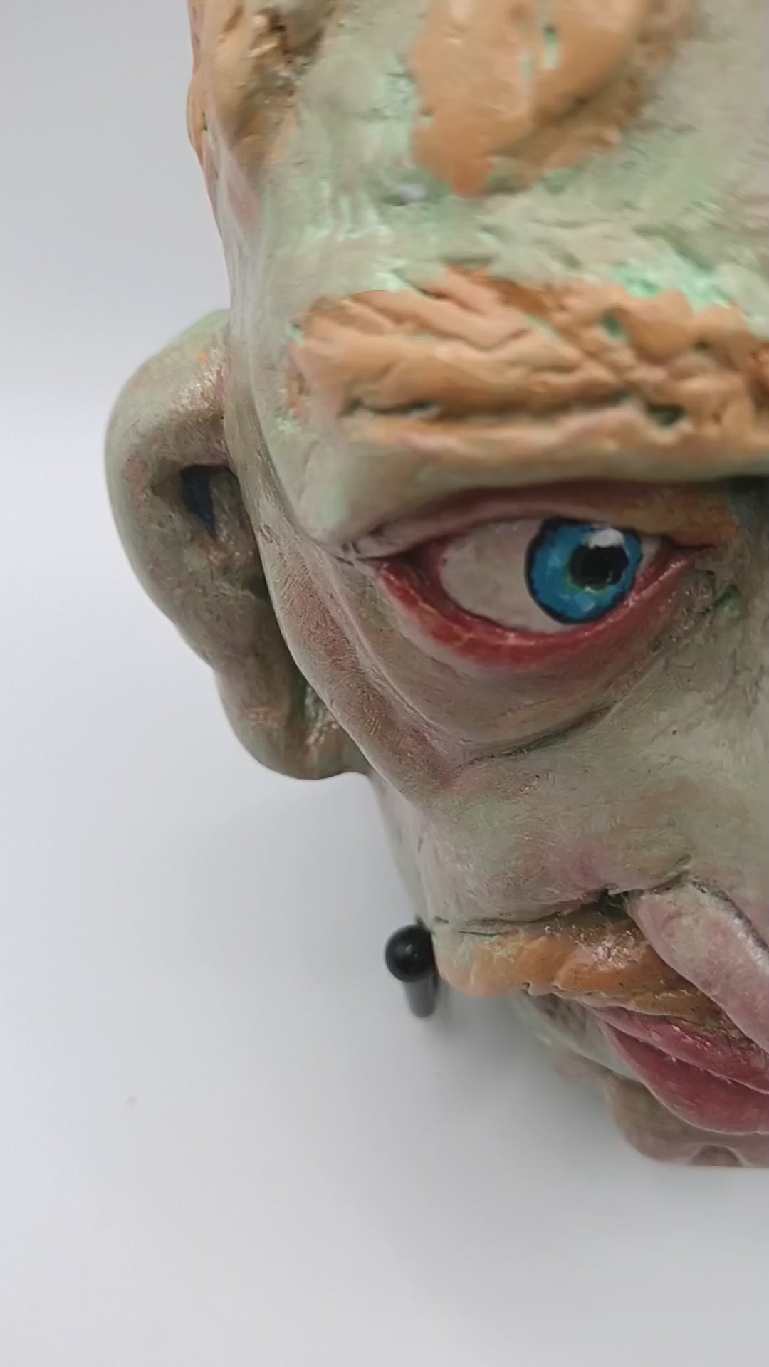 Hand sculpted green man sculpture lightbox video