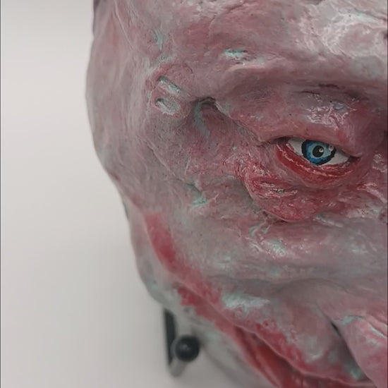  creepy grinning hand sculptured horror sculpture lightbox video