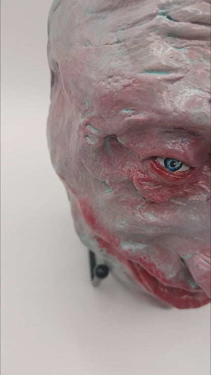  creepy grinning hand sculptured horror sculpture lightbox video