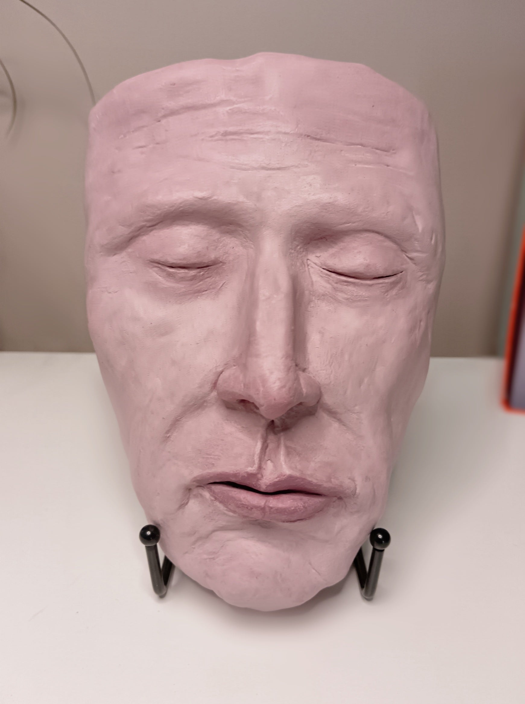 Francis underwater, hand sculpted death mask sculpture with stand, home setting 