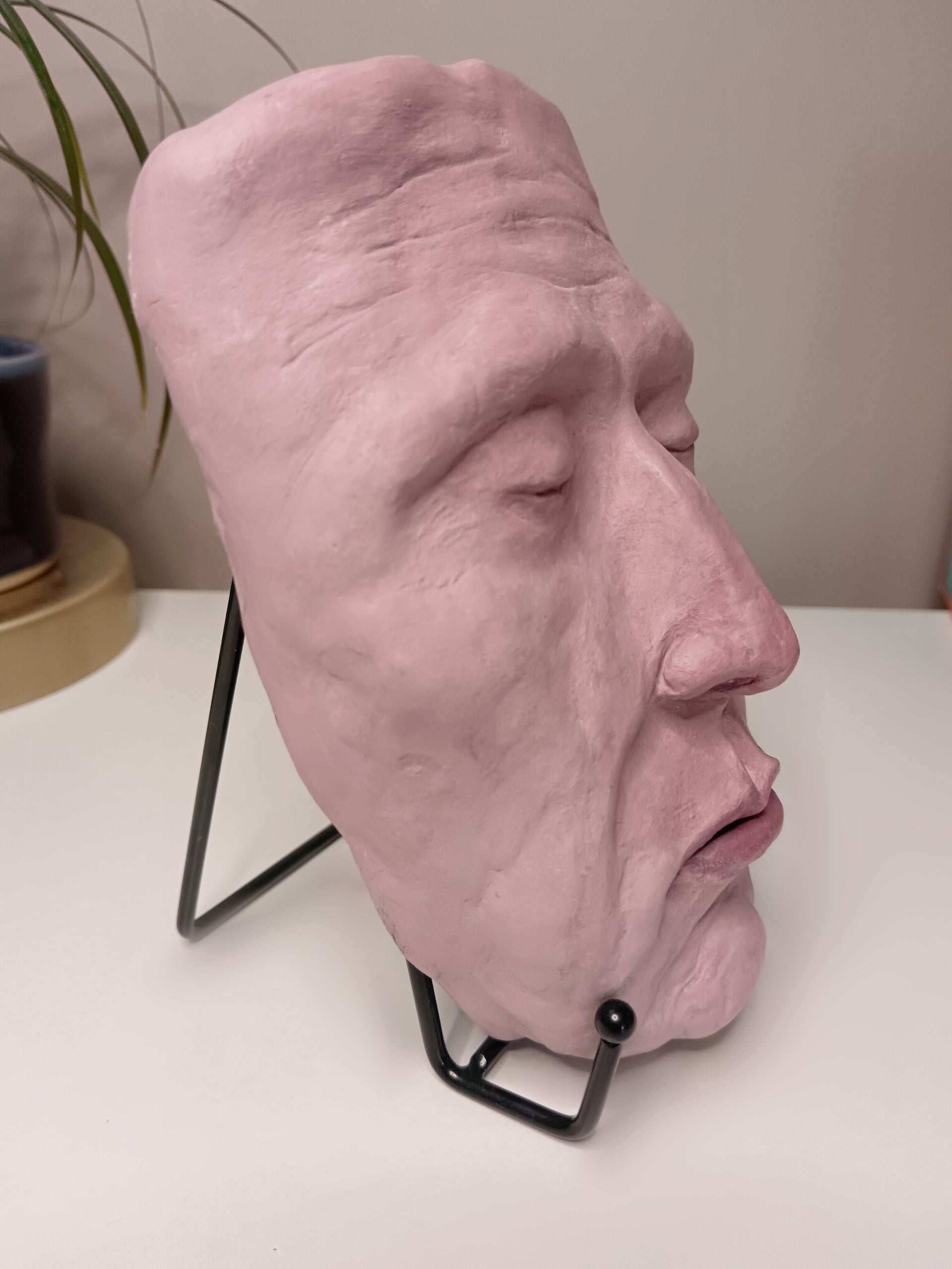 Francis underwater, hand sculpted death mask sculpture with stand, home setting side view
