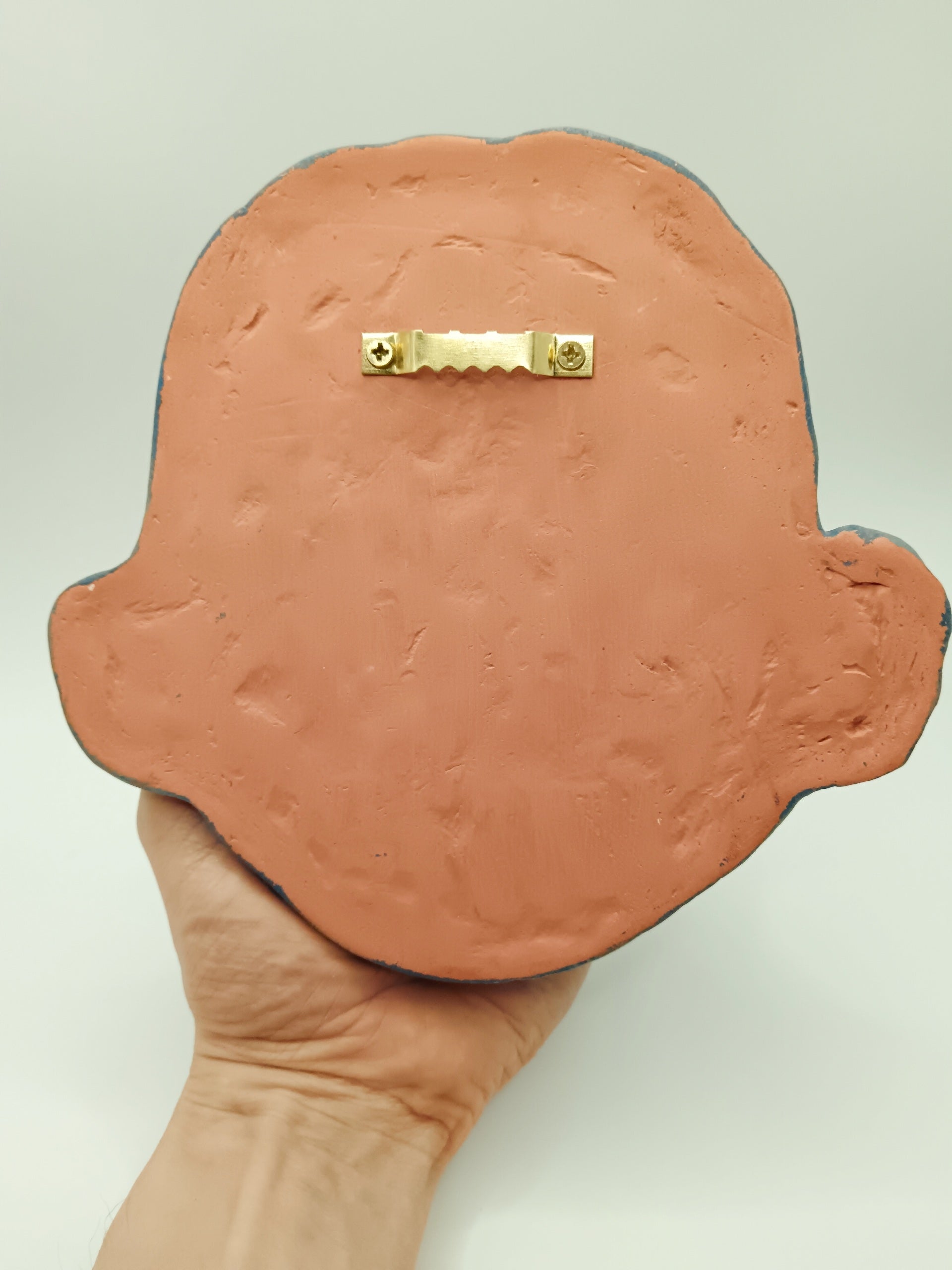 Handmade sculpture, back view with sawtooth hanger 