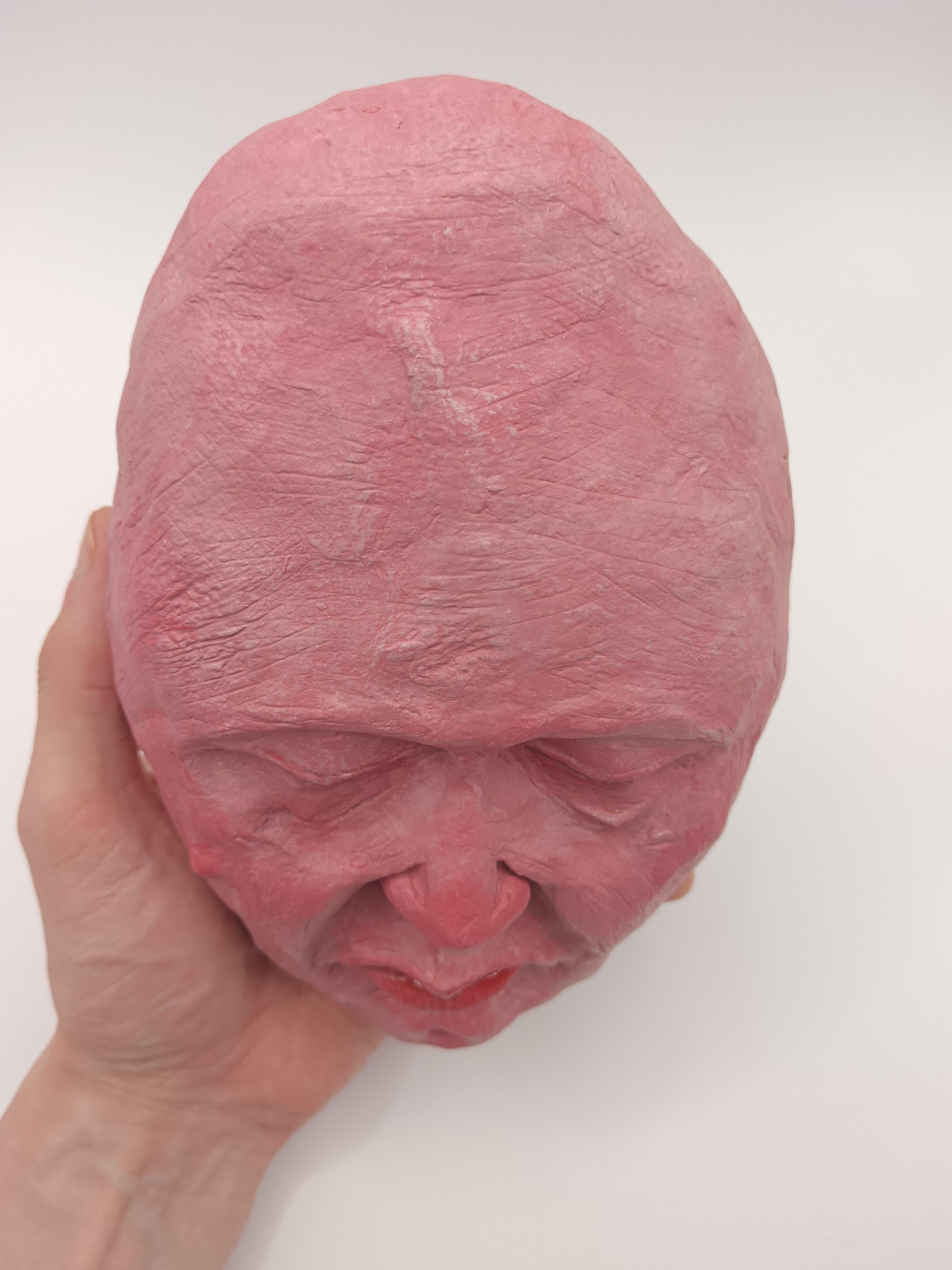 hand sculpted egghead sculpture, top view