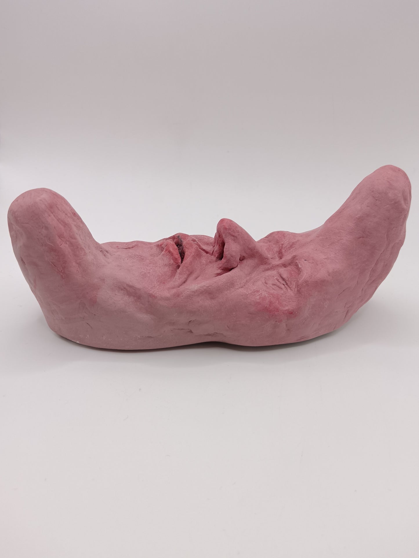 pink crescent moon sculpture side view