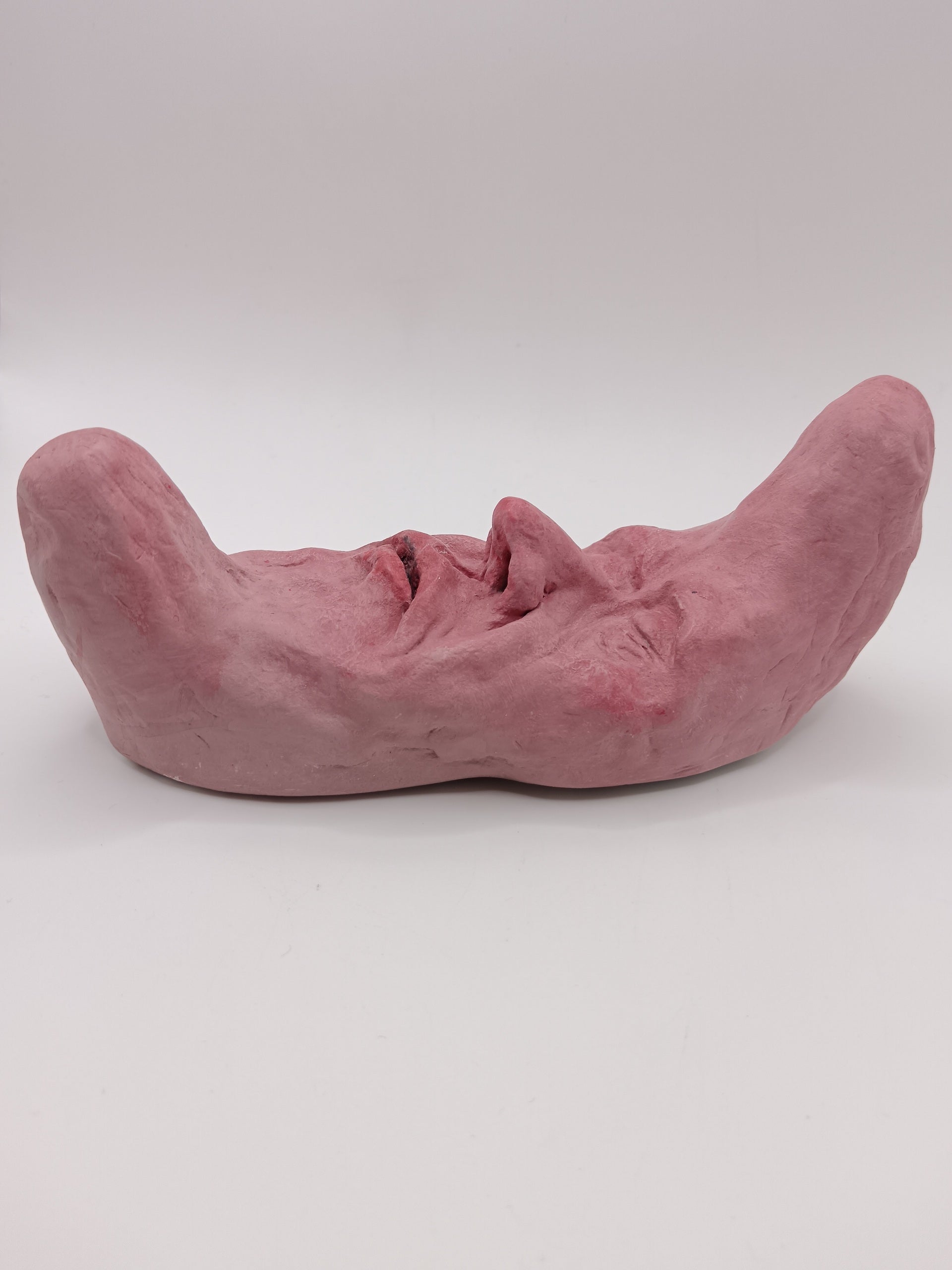 pink crescent moon sculpture side view