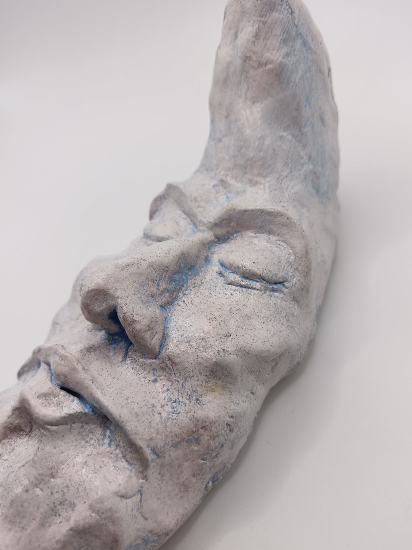 handmade sleeping moon sculpture close-up