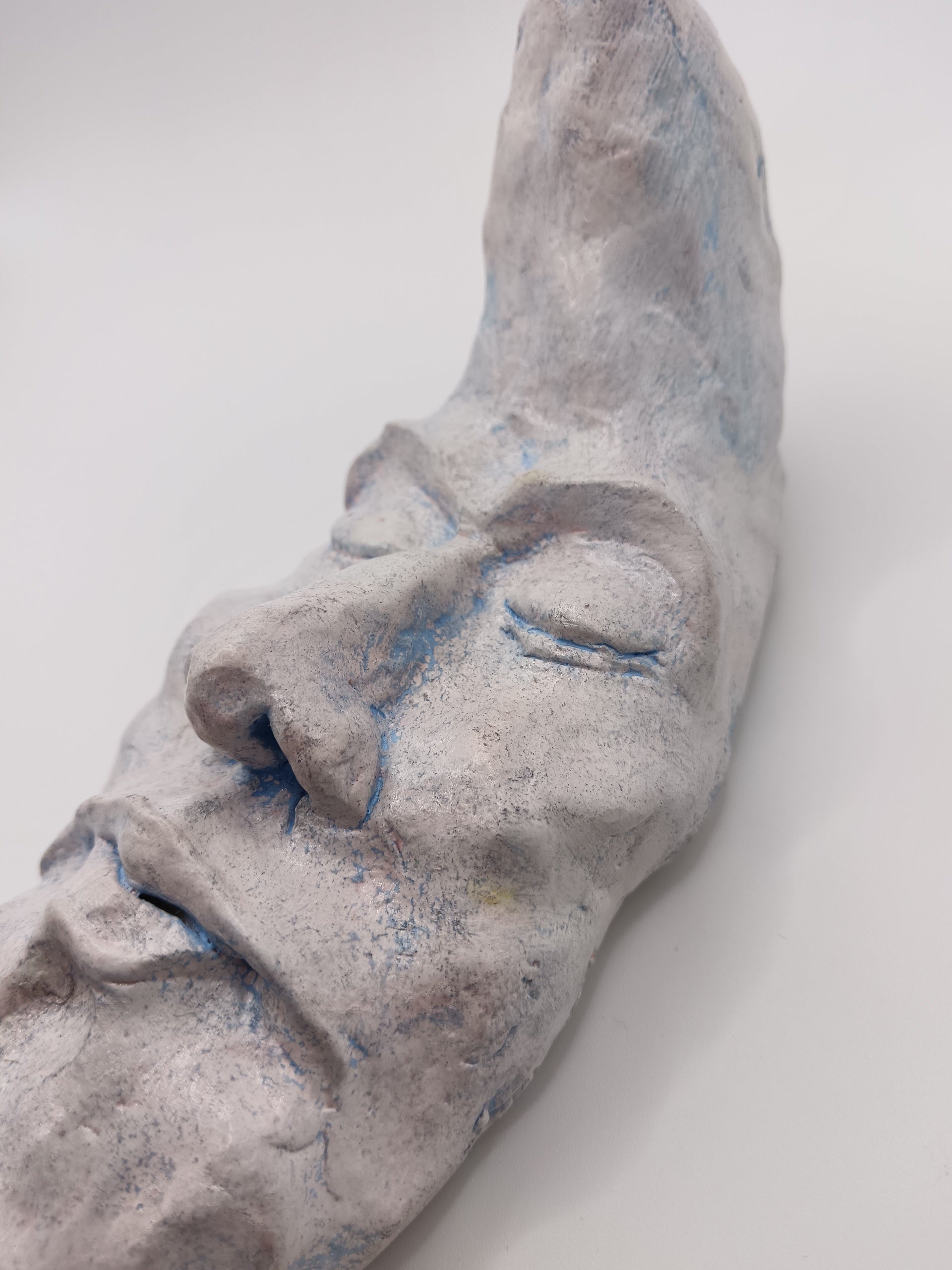 handmade sleeping moon sculpture close-up