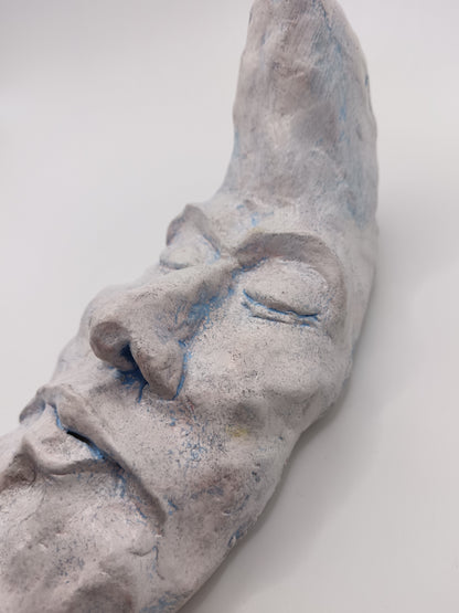 handmade sleeping moon sculpture close-up