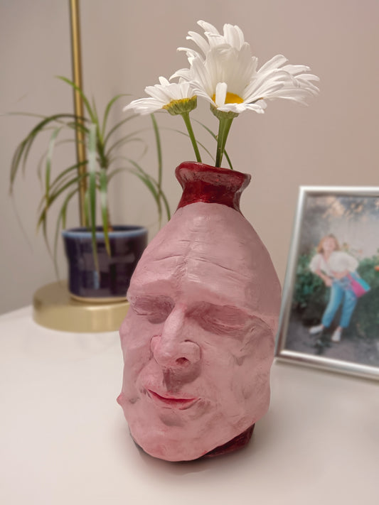 Handmade clay death mask vase, with flowers