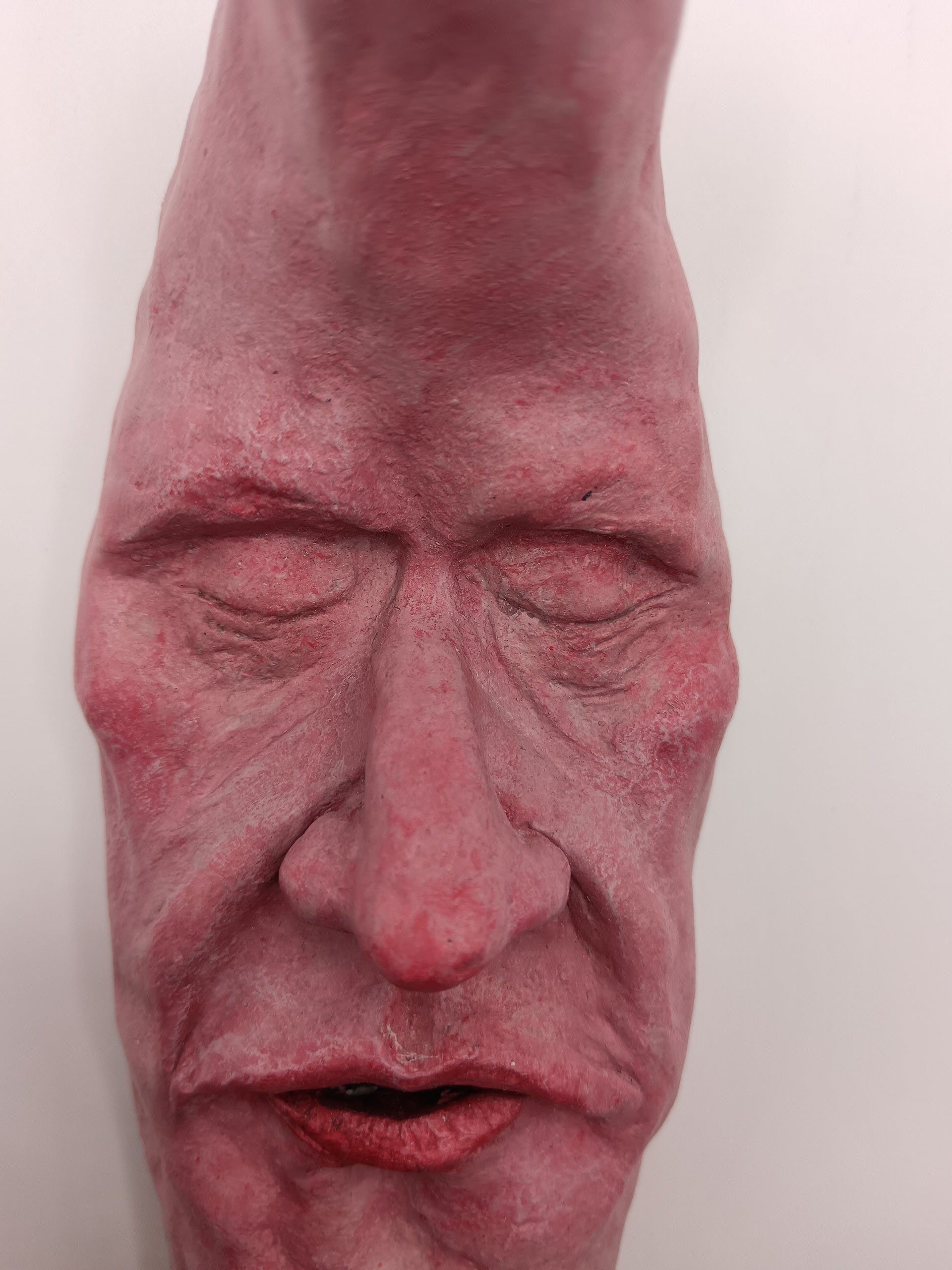 pink crescent moon sculpture close-up detail 