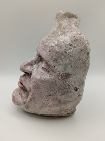 Airy dry clay vase - male face, left side