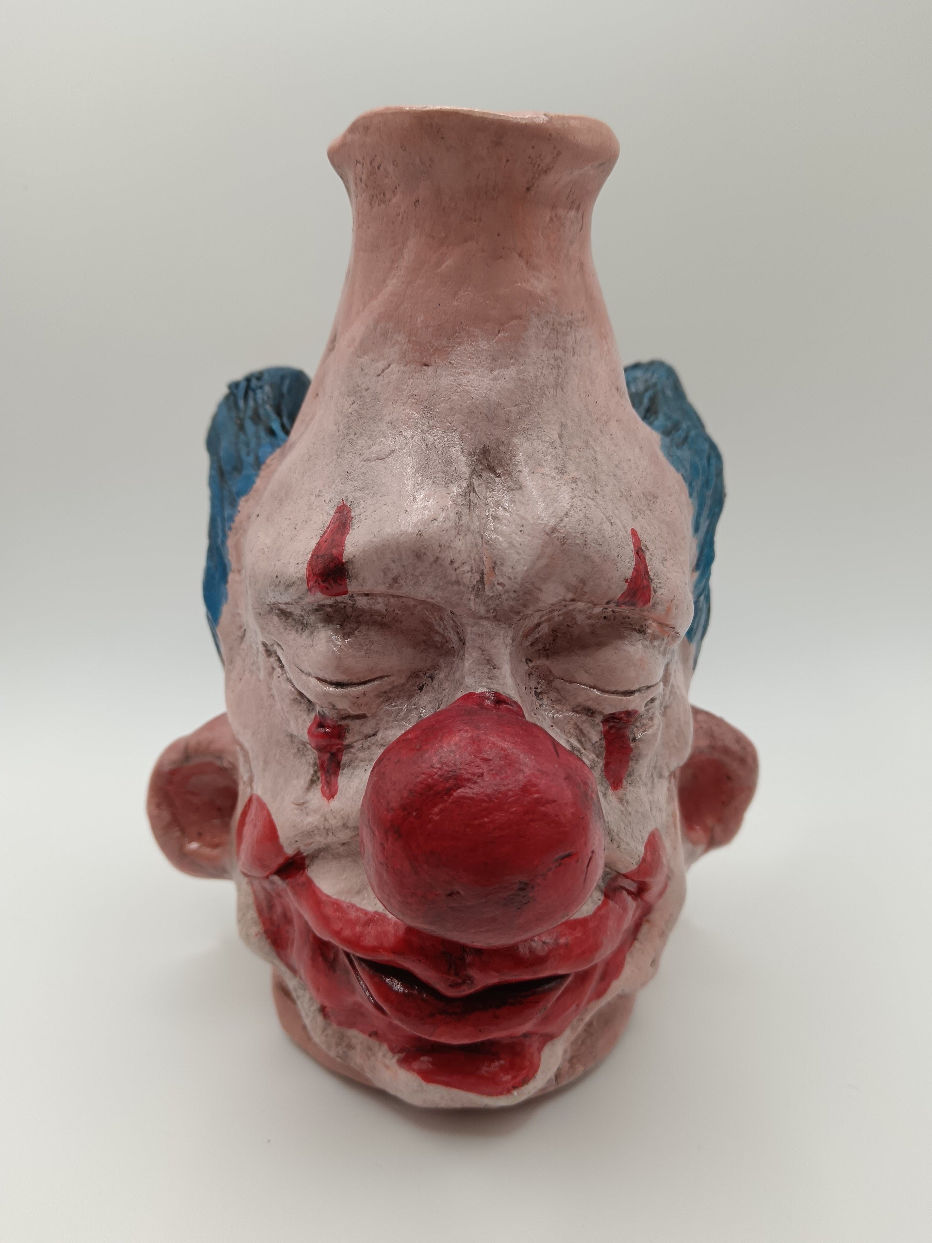 Handmade clay clown vases with blue hair 