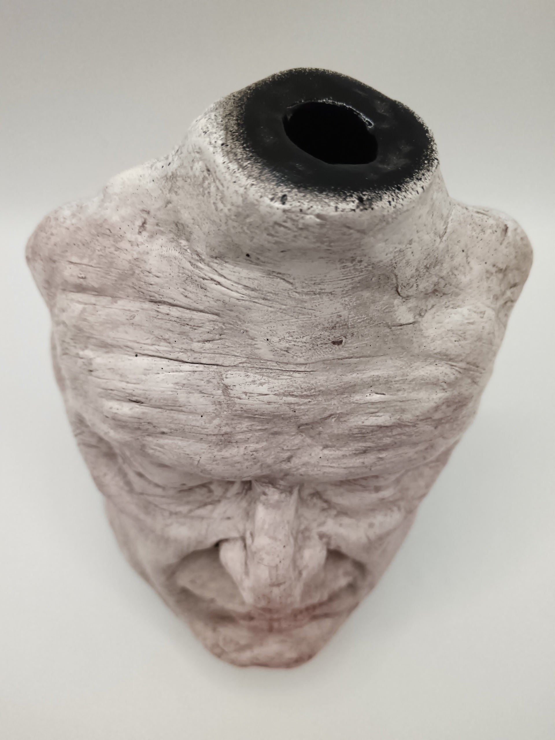 Airy dry clay vase - male face, top