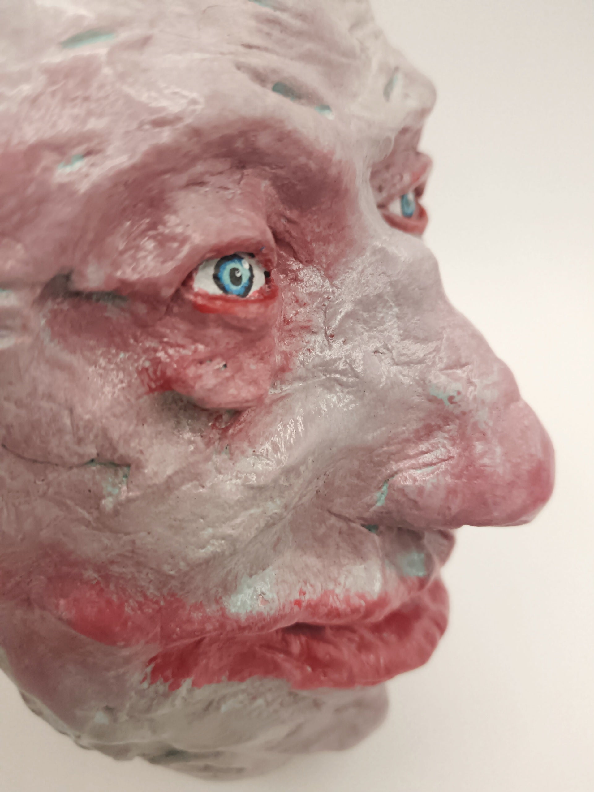  creepy grinning hand sculptured horror sculpture close up