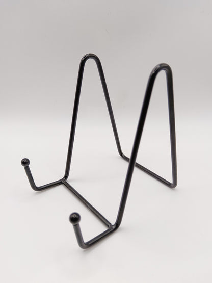Black metal stand on a white background