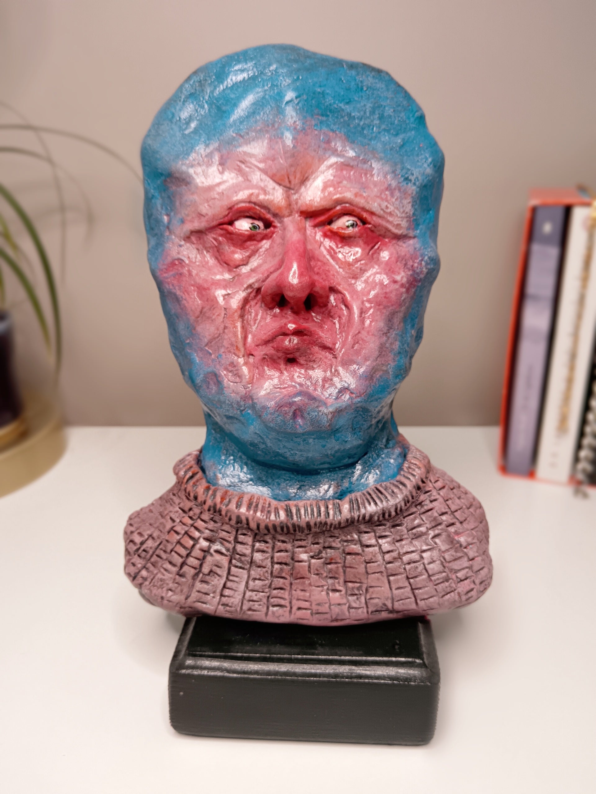 handmade clay alien sculpture, home setting