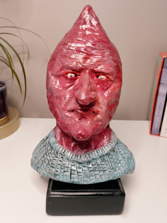 handmade airdry clay alien sculpture, home setting