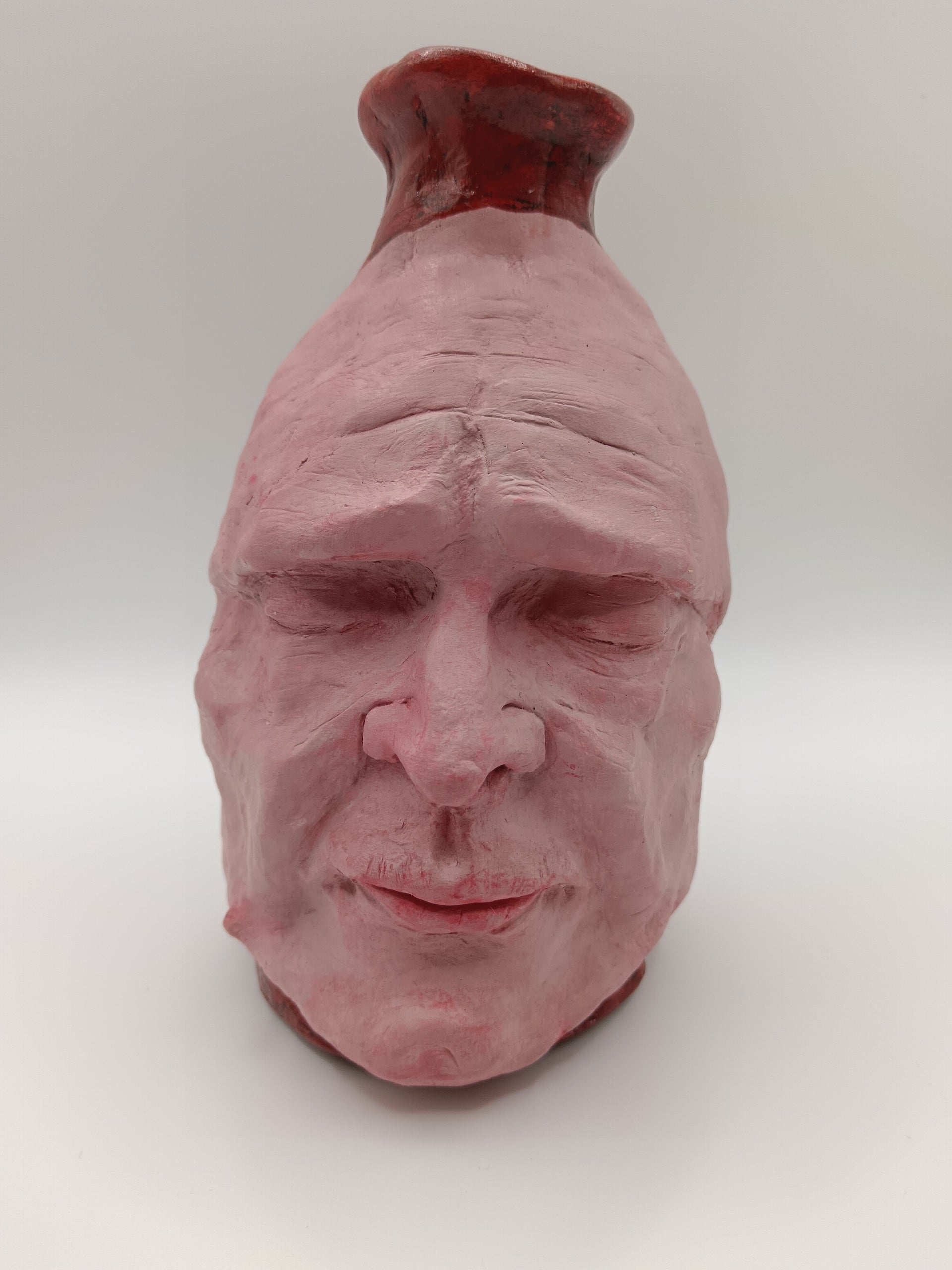 Handmade clay death mask vase, front