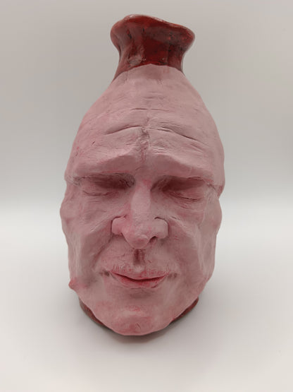 Handmade clay death mask vase, front