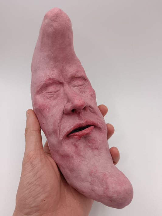 pink crescent moon sculpture 