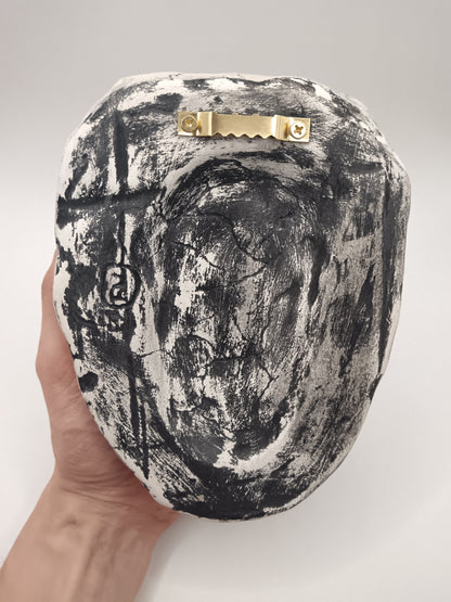 Back of sculpture with sawtooth hanger