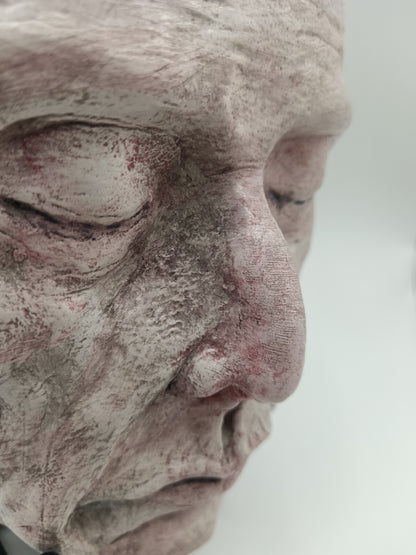white Death mask Hand sculpted clay sculpture close up