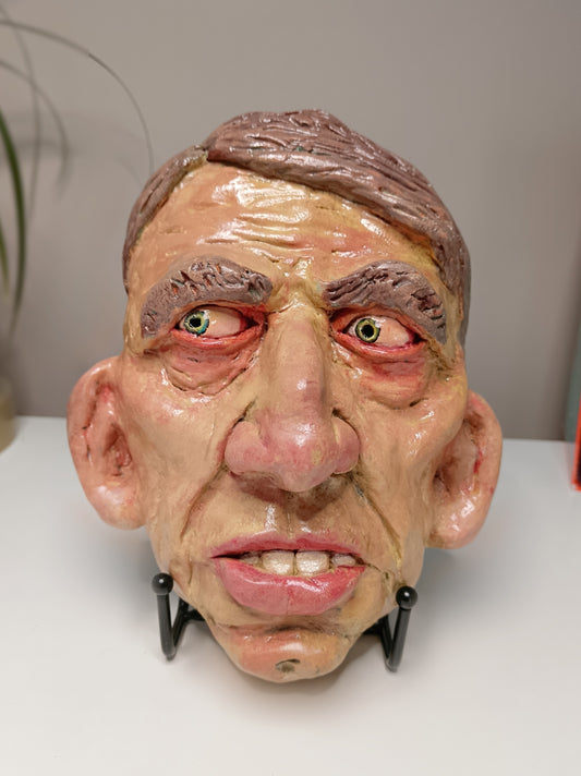 Hand sculpted clay yellow face mask sculpture
