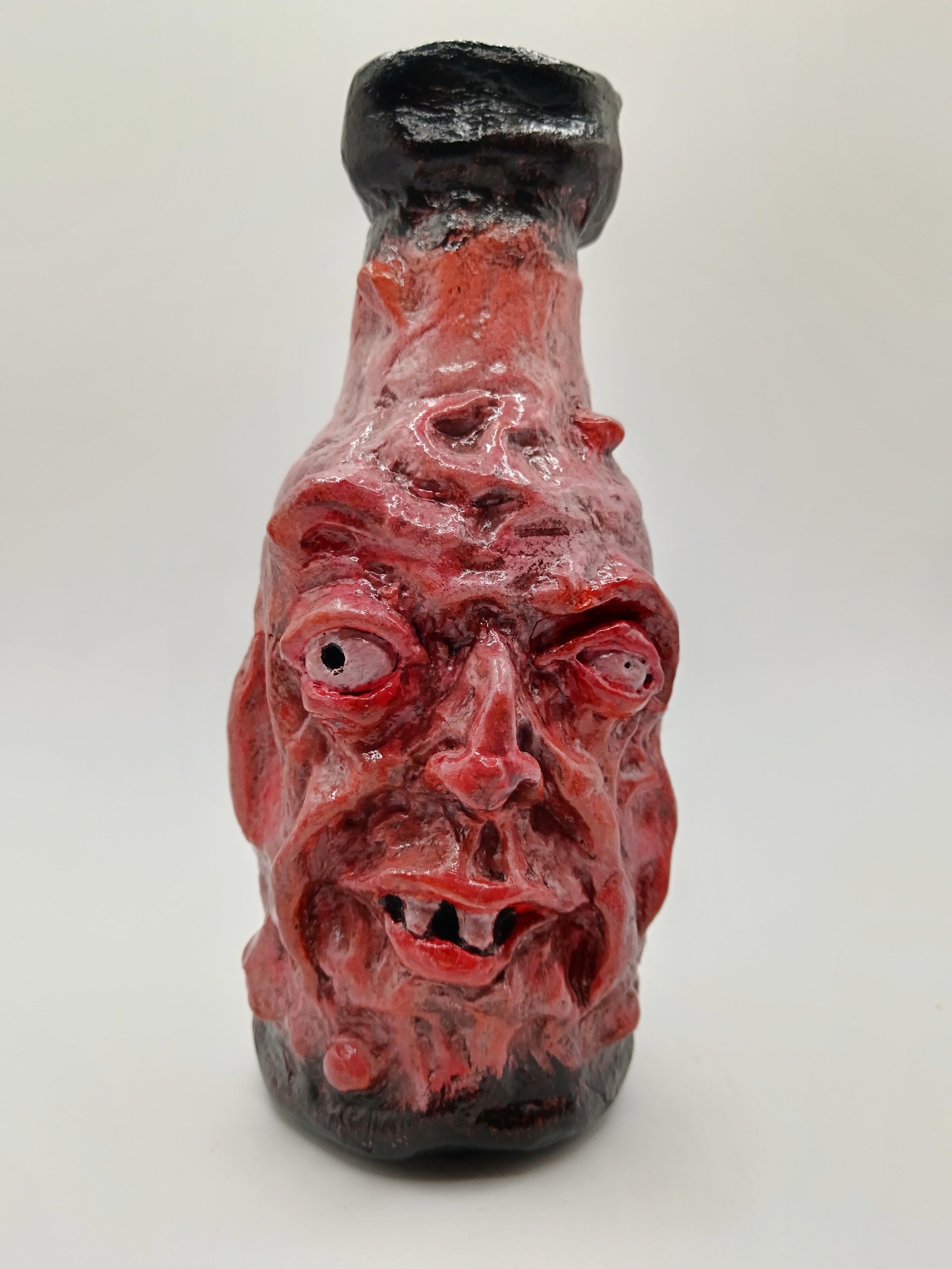 grotesque handmade face vase 
