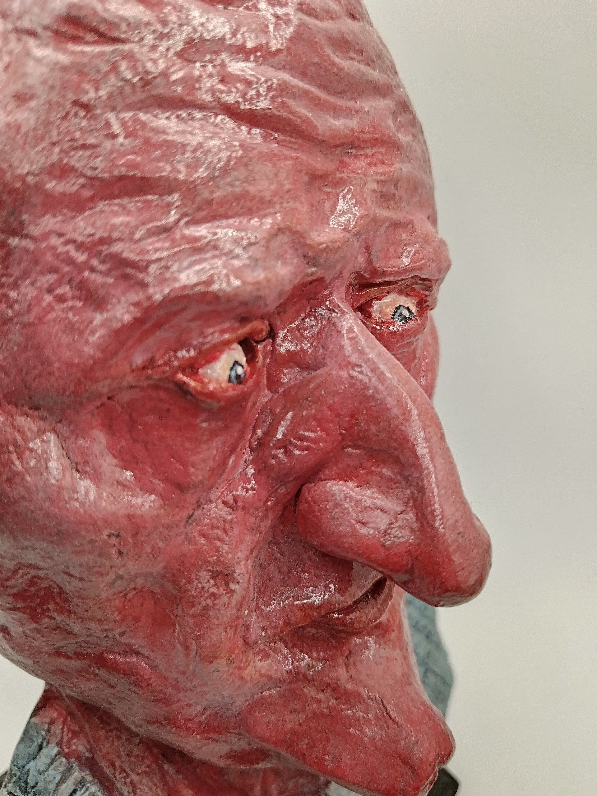 handmade airdry clay alien sculpture, close-up