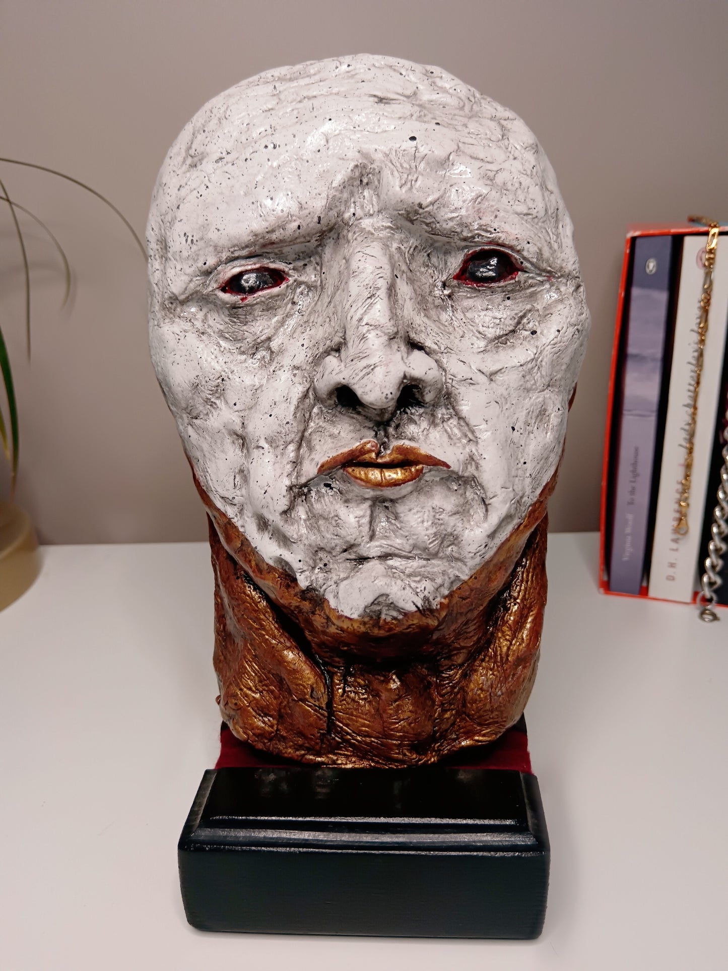 Handmade white and gold clay sculpture