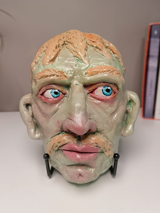Hand sculpted green man sculpture