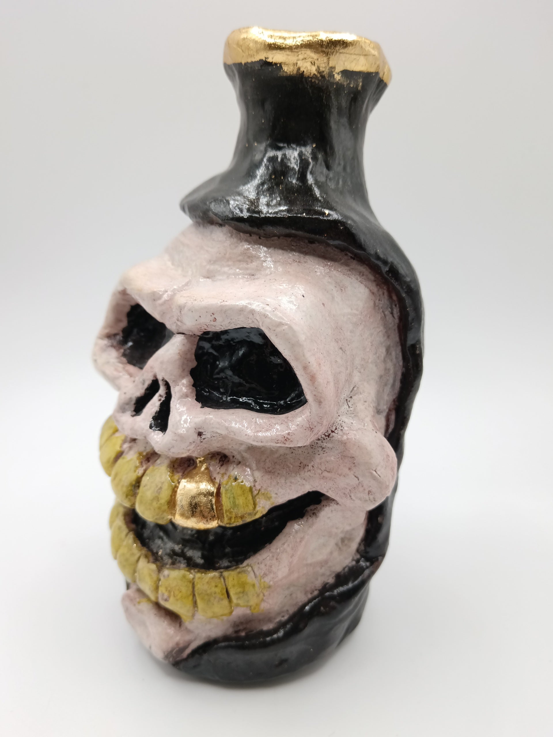 hand sculpted Skull vase left view