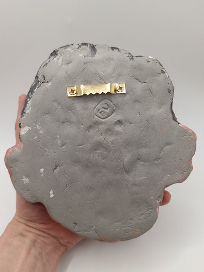 back of sculpture with sawtooth hanger