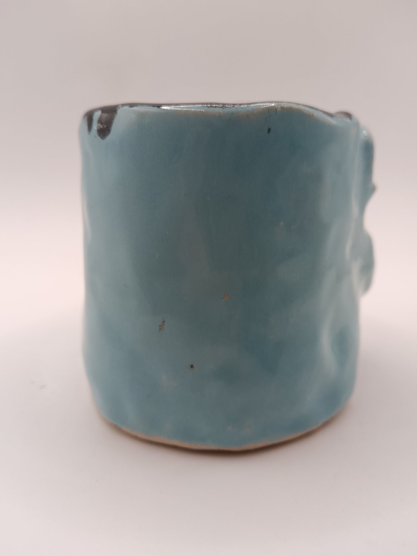 Blue ceramic mug on a white background