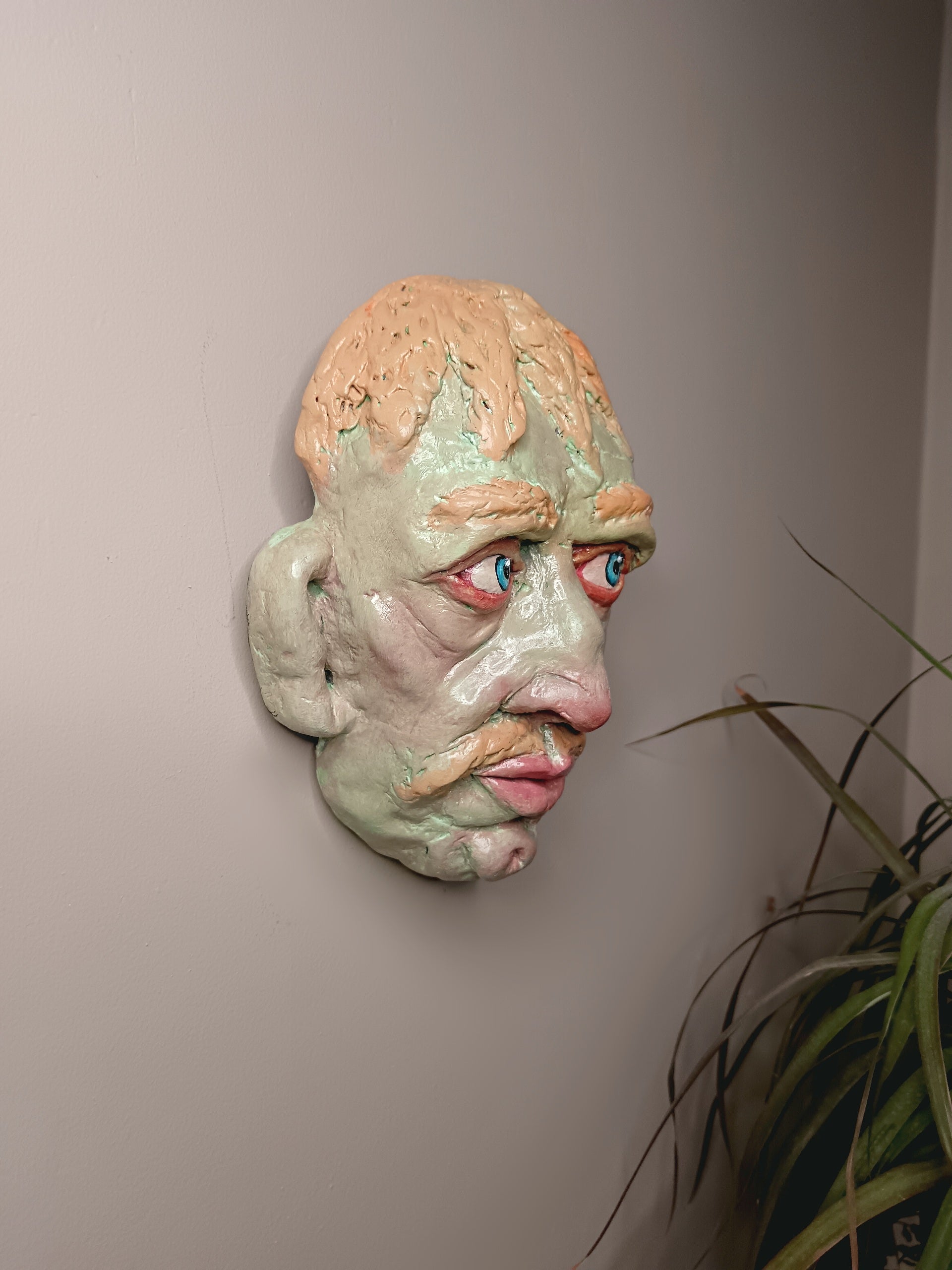 Hand sculpted green man sculpture wall art side
