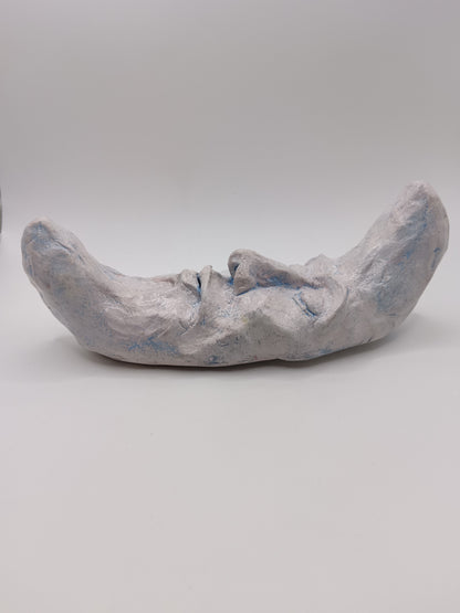 handmade sleeping moon sculpture side view